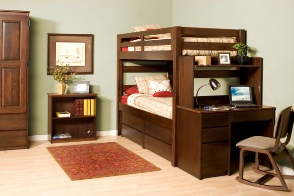 a bedroom with bunk beds, desk and chair in front of the bed has a rug on the floor