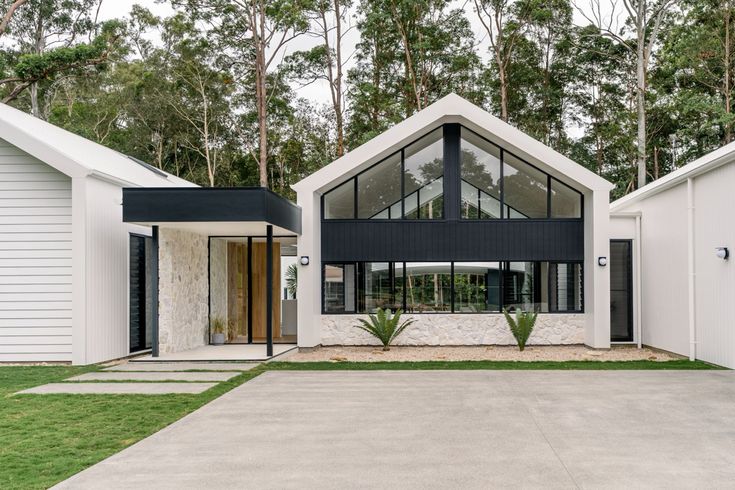 a white house with black shutters and windows