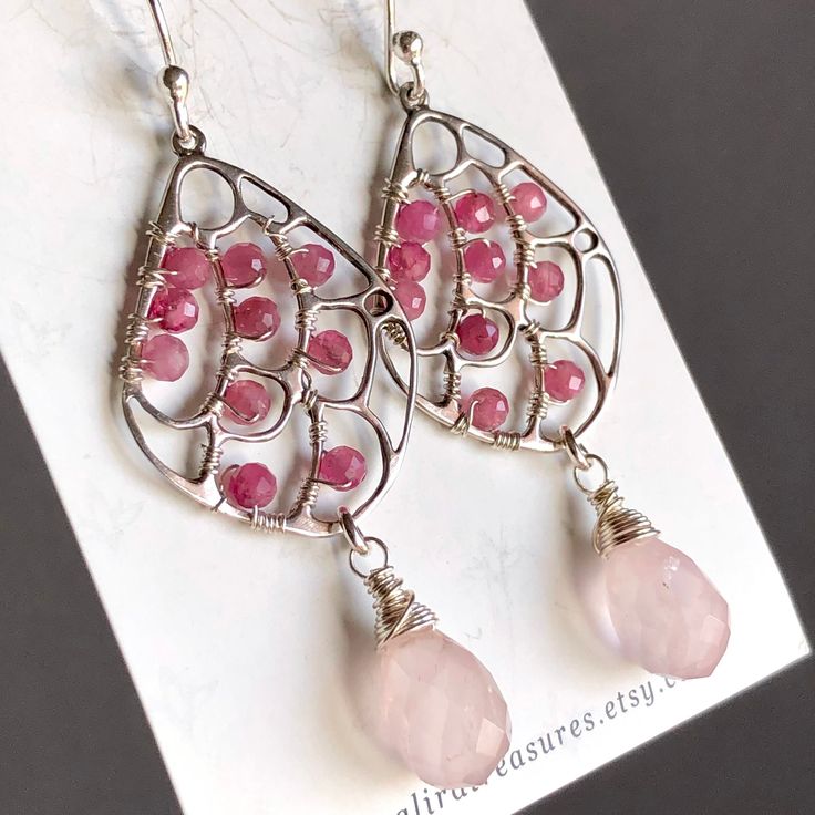 7371 These gorgeous bold statement dangle drop earrings were meticulously handcrafted with natural rose quartz, pink tourmaline and sterling silver wire and components. Emanating elegance and style this pair will make perfect birthday, anniversary, appreciation or holiday gift for yourself or special woman in your life - mom, wife, girlfriend, daughter, sister, grandma, niece, aunt, cousin, best friend, teacher, coach, doctor, caregiver or colleague.  MATERIALS & DIMENSIONS ✦ Genuine natural gem Pink Rose Quartz Wire Wrapped Jewelry, Pink Sterling Silver Briolette Earrings, Pink Briolette Sterling Silver Earrings, Nickel-free Pink Drop Jewelry, Pink Rose Quartz Jewelry With Ear Wire, Pink Nickel-free Drop Jewelry, Bohemian Sterling Silver Hand Wrapped Earrings, Bohemian Sterling Silver Hand-wrapped Earrings, Hand Wrapped Rose Quartz Pink Jewelry