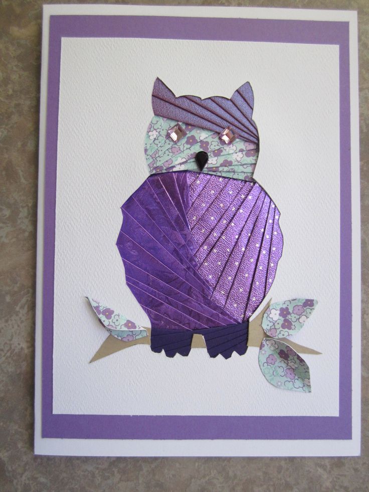 a card with an owl on it's back made out of purple and white paper