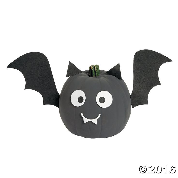 a halloween pumpkin with a bat decoration on it