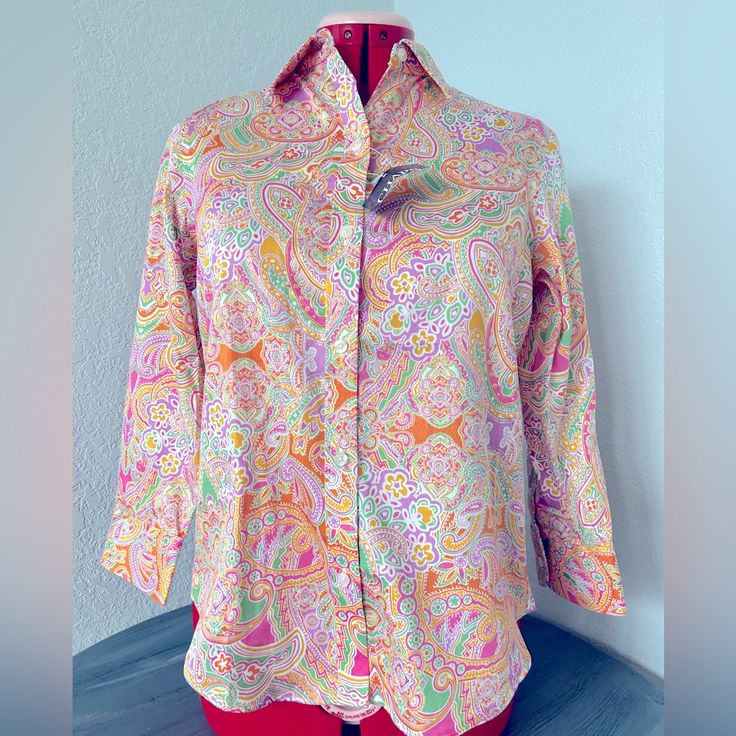 Chaps Classic No-Iron Blouse Bright Spring Paisley White Background, With A Beautiful, Bright Pink, Yellow, Orange, Green, White, And Purple Pattern Button Down Beautifully Tailored Long Sleeves Bust: 37 Inches Length: 21.5 Inches Size: Xs New With Tags Printed Long Sleeve Tops For Daywear, Casual Collared Tops With Paisley Print, Patterned Blouse With 3/4 Sleeves, Spring Long Sleeve Tops With Paisley Print, Spring Cotton Tops With Paisley Print, Multicolor Paisley Print Blouse For Spring, Fitted Printed Pink Tops, Fitted Paisley Print Blouse For Spring, Fitted Pink Printed Tops