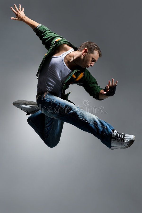 a man flying through the air while wearing jeans and a t - shirt with an eagle on it