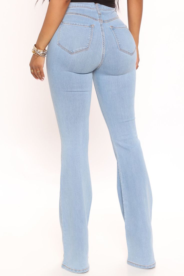 Our sexiest flare jean is offered in a range of washes in a high stretch, super soft fabric that hugs every curve. Fitted in the hips and thighs while flaring at the knee, these jeans elongate the legs and are perfect with a heel. Now offered in a range of washes, colors, and inseams. Available In Multiple Washes Petite 31" Inseam, Regular 34" Inseam, & Tall 37" Inseam High Stretch Denim 11.5" High Rise 22" Flare Leg Opening Faux Front Pockets Functional Back Pockets Disclaimer: Due To The Speci Stretch High Rise Medium Wash Flares, Stretch Medium Wash Jeans With Flare, High Rise Denim Flares, Mid-rise Stretch Flare Jeans, Mid-rise Stretch Denim Flare Jeans, Stretch Mid-rise Flare Denim Jeans, Stretch High-rise Flare Jeans, High Rise Stretch Denim Flare Jeans, Blue Stretch Flare Jeans