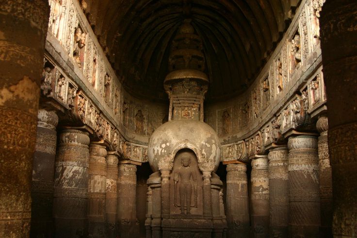 an ancient building with columns and carvings on the walls is framed by a gold frame