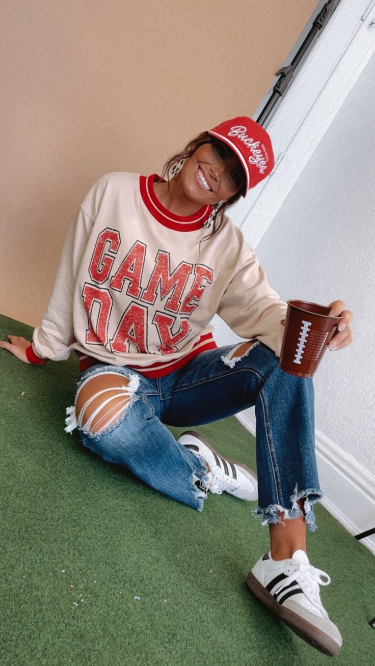 Get ready to take on game day in style with our Vintage Gameday Pullover Sweatshirt, Red! This sweatshirt offers a vintage look. Show off your gameday spirit and make a statement with this game day essential! Vintage gameday Pullover Red Vintage outfit inspo Striped round neckline Striped band cuffs Relaxed fit 53% Cotton 47% Poly Measurements/Sizing: (Approximate. Measured lying flat.) S- Size 4/6 Length 25" M- Size 8/10 Length 25 1/2" L- Size 12/14 Length 26" Model Specs: Emily is wearing a size small in the photo.How will this item fit you? Check out our MODEL SPECS (Typical Sizing - Karli: S-Size 5/26 - 5ft 2in, Emily: S-Size 3/25 - 5ft 5in, Syd: L/XL- Size 15/ - 5ft 8in)Need help with sizing? No problem! Join our VIP group on Facebook, Everyday Chic Boutique VIP Insiders to chat direc Winter Game Day Outfit Football, Winter Game Day Outfit, Game Day Outfit Football, Gameday Outfits, Game Day Outfit, Vip Group, Vintage Outfit, Game Day Shirts, Everyday Chic