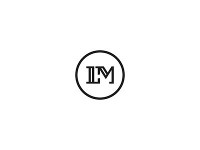 the letter m is inscribed in a circle on a white background with black lettering, and it