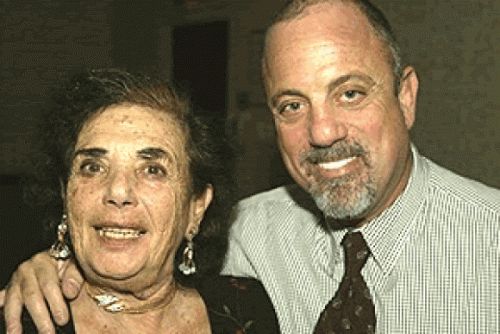 an older man and woman posing for the camera