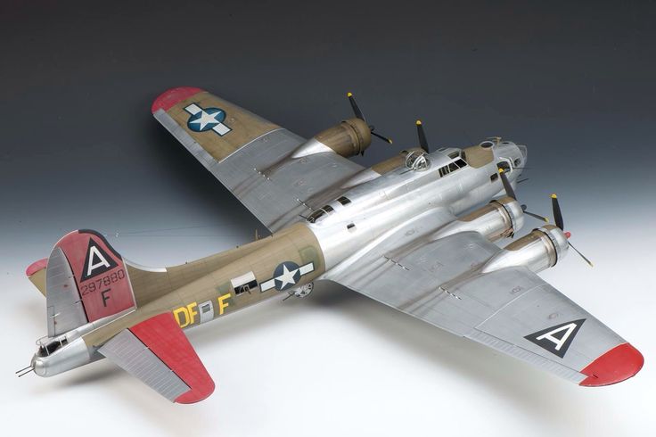 an old model airplane on a white background