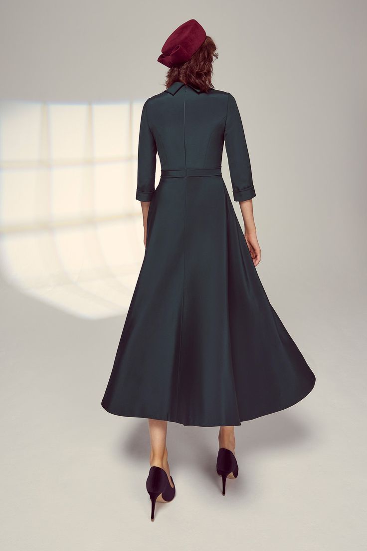 An elegant full skirted dress, the Silk Cowl Neck Riding Dress in Forest is softly tailored from our signature high quality Italian silk crepe, which has a wonderful fluidity, weight and drape. A rounded cowl neck collar falls beautifully to expose the décolletage and frame the face. Featuring 3/4 length sleeves with a fixed cuff and a full skirt which dips down at the back, this dress has a centre-back invisible zip for step-in ease, and is fully lined in silk. Style with soft grey, navy, or me Elegant Fit And Flare A-line Evening Dress, Elegant A-line Maxi Dress With Fitted Bodice, Elegant A-line Dresses With Pleated Waist, Elegant A-line Tea Length Cocktail Dress, Elegant Satin A-line Dress, Classic A-line Satin Dress, Elegant H-line Dresses With Flattering Silhouette, Elegant Formal H-line Maxi Dress, Formal A-line Evening Dress With Flattering Silhouette