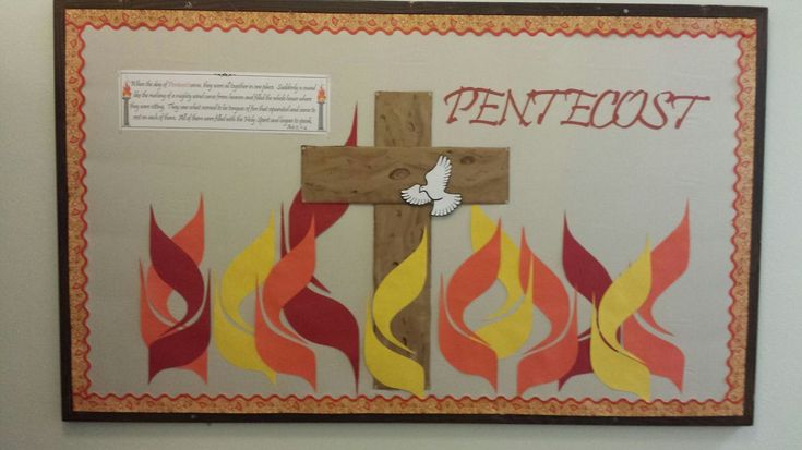 a bulletin board with a cross on it and flames in the background that say pentecost