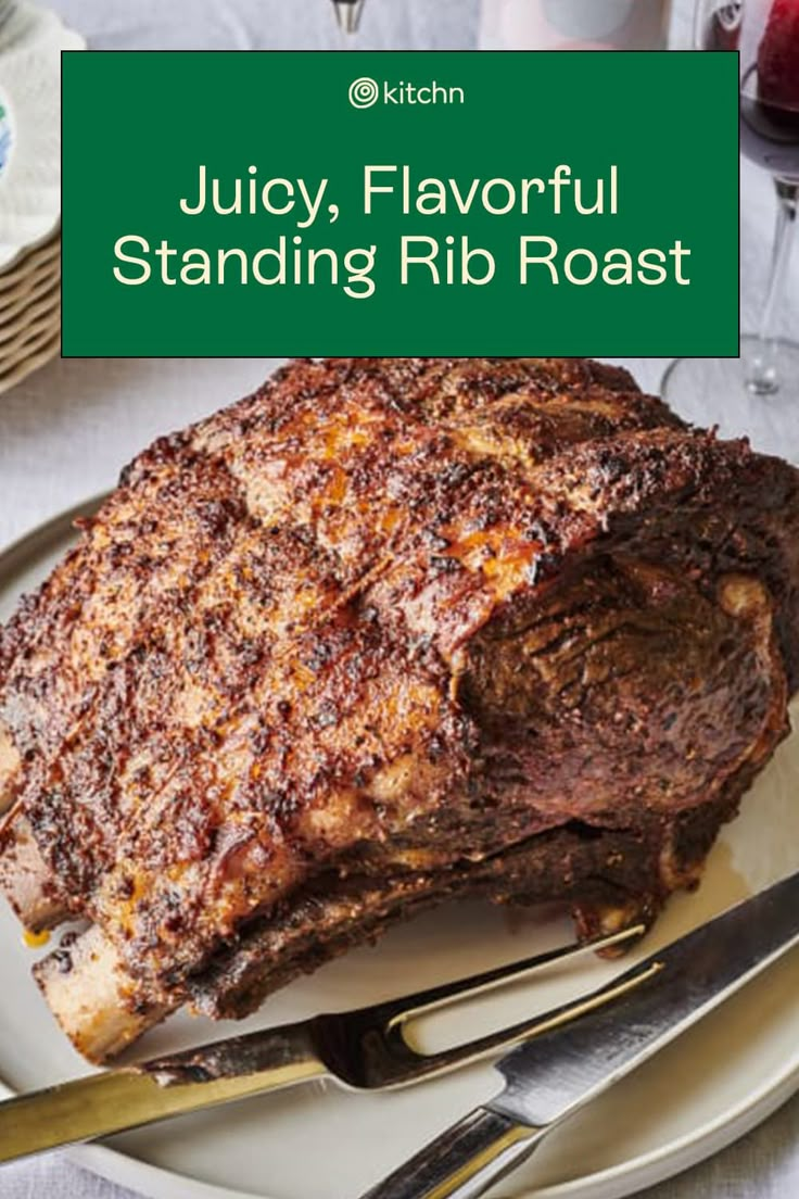 juicy, flavorful standing rib roast on a plate with fork and knife next to it