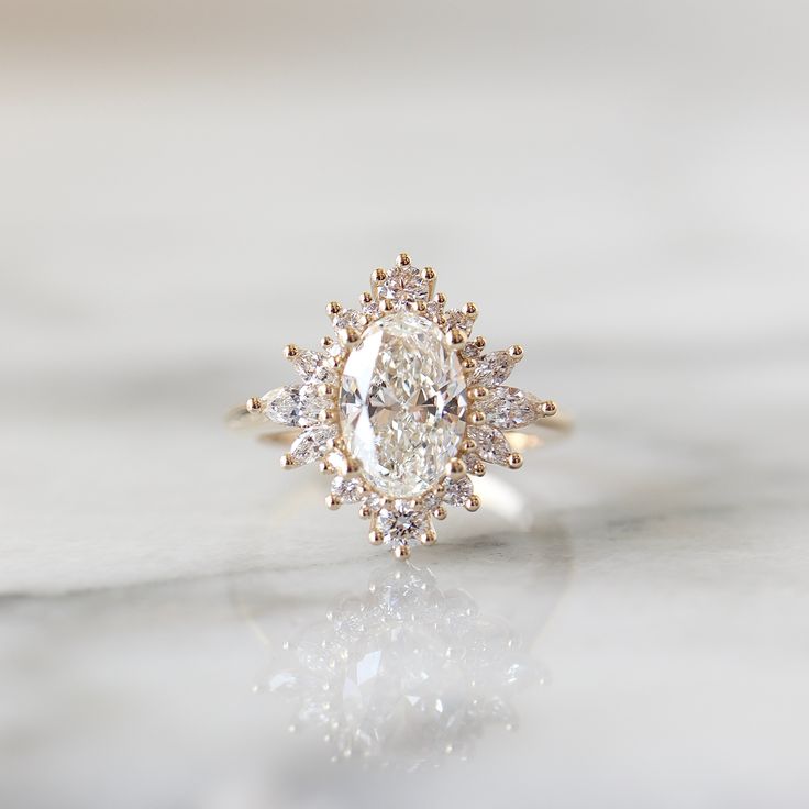 a diamond ring sitting on top of a table