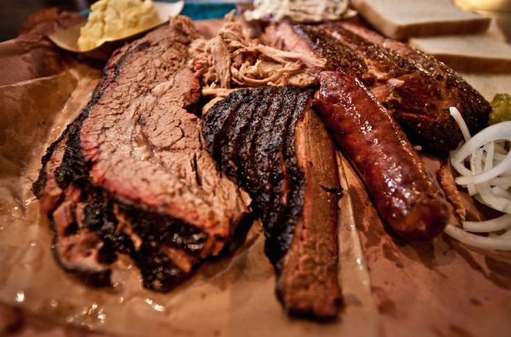 there are many different types of meats on the table together, including ribs and steak