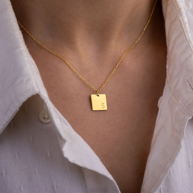 "Stylish and minimalist 14K gold personalized rectangle necklace for everyday wear. Great for layering.  Unique personalized gift idea to show love to the important people in your life with a cute, dainty, and creative gift. Customized rectangle tag necklace makes a perfect birthday gift for mothers, friends or yourself.  A special anniversary gift for significant others. Just engrave his/her name. It is a perfect gift. It can be dressed up or dressed down depending on the situation. We only use the highest quality 925 sterling silver or 14 solid gold in our workshop.  ♥ All our jewelry is custom made with Love and Care in our workshop. ✿Unless \"Solid Gold\" option is specifically chosen from the \"Finish\" dropdown menu, your jewelry will be 14k gold plated over 925 sterling silver. ✿ MA Everyday Personalized Square Pendant Necklaces, Simple Rectangular Jewelry For Anniversary, Dainty Initial Necklace With Square Pendant As A Gift, Dainty Initial Square Pendant Necklace For Gift, Dainty Square Pendant Initial Necklace For Gift, Dainty Square Pendant Initial Necklace As Gift, Minimalist Engraved Rectangular Necklace, Everyday Name Necklace With Rectangular Pendant, Classic Gold Rectangular Charm Necklace