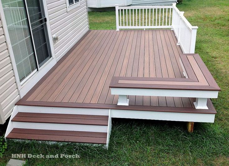 a wooden deck with steps leading up to it