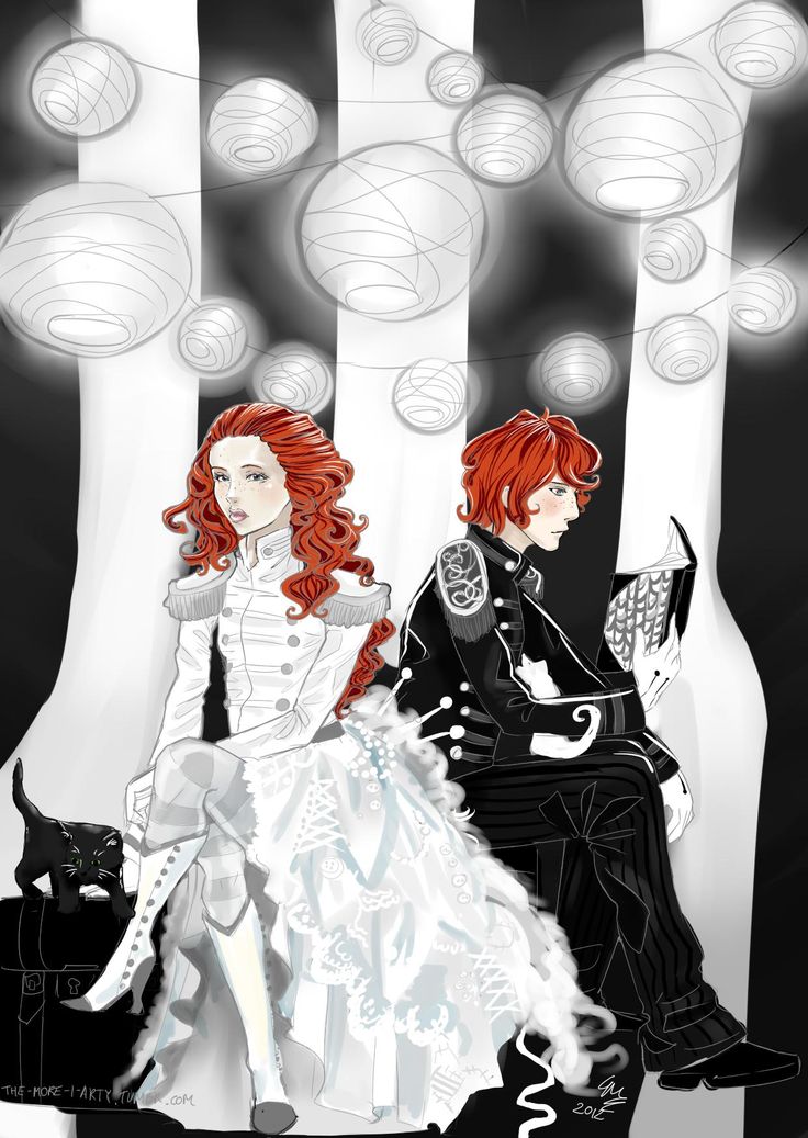 two people sitting on a bench in front of lights and balls, one with red hair