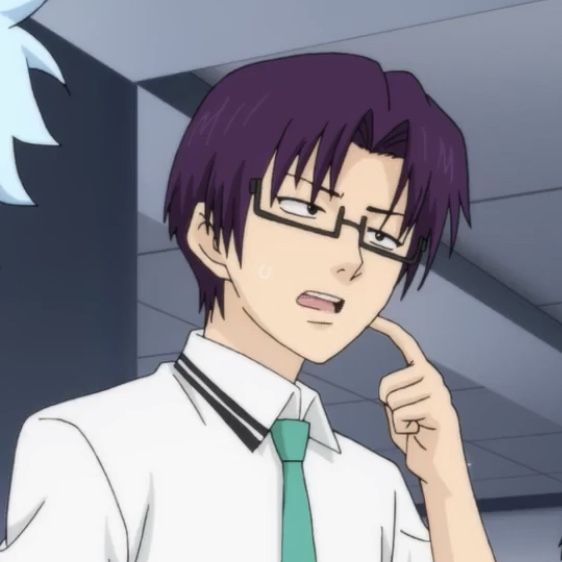 a man with purple hair and glasses is pointing to his index finger while wearing a green tie