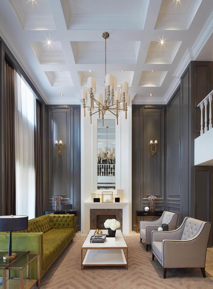 a living room filled with furniture and a chandelier