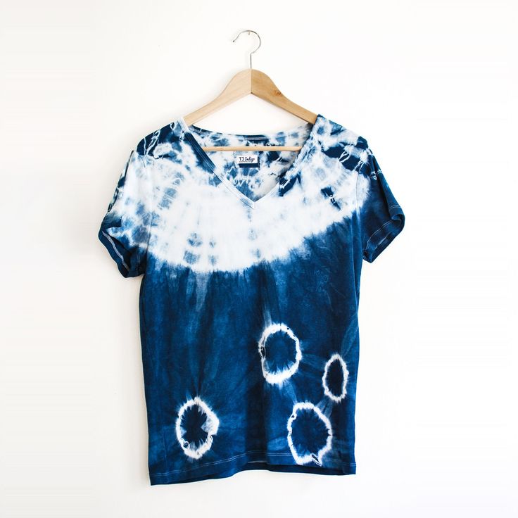 This ultra soft bamboo rayon+cotton t-shirt is hand dyed with natural, plant based indigo in dark blue and white shibori shapes, your boho chic statement t-shirt.  Fit: tailored, flattering, not too tight. Crewneck. 70% viscose from organic bamboo, 30% organic cotton. Each one is always one of a kind. Chest Width: XS: 33-34. S: 35-36. M: 37-38. L:39-41. XL:42-46. 2XL:46-52 T-shirt made by ONNO and dyed by me. To prolong the life of your indigo dyed textiles we recommend machine wash cold with si Pre-washed Indigo Cotton Tops, Pre-washed Tie Dye T-shirt For Summer, Relaxed Fit Tie-dye T-shirt With Natural Dye, Indigo Washed Short Sleeve Tops, Indigo Tops Pre-washed Relaxed Fit, Indigo Relaxed Fit Pre-washed Tops, Indigo Top With Relaxed Fit, Pre-washed, Summer Blue Pre-washed Tops, Relaxed Fit Tie Dye Tops With Natural Dye