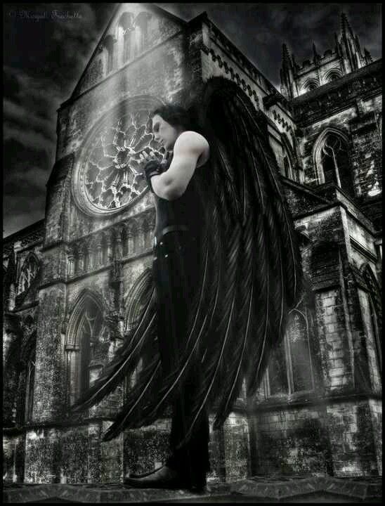 an angel standing in front of a gothic church with long black hair blowing in the wind