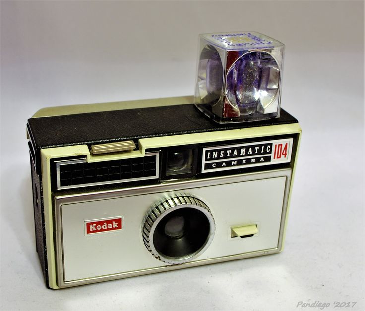 an old kodak camera with its flash light on top