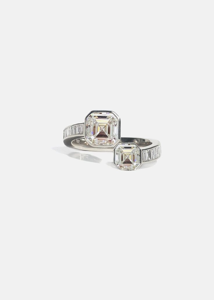 —Cosma Collection Celebrating love. A collection to remember the unforgettable moments, special occasions, and the beauty of what life brings. An iconic symbol of continual happiness and love. Crafted of polished 18K gold, The Duét Asscher Ring is designed to emulate the diamond silhouette in a clean bezel setting with a waterfall of baguette diamonds band. 2.85tcw / 4.93 grams 1.7ct G color, VS2 clarity (GIA) 0.80ct G color, VS2 clarity (GIA) 0.35ct Baguette Diamonds Custom variations can be ma Asscher Ring, Diamond Silhouette, Baguette Diamond Band, Baguette Diamonds, Engagement Bands, Band Engagement Ring, Cute Accessories, Baguette Diamond, What Is Life About