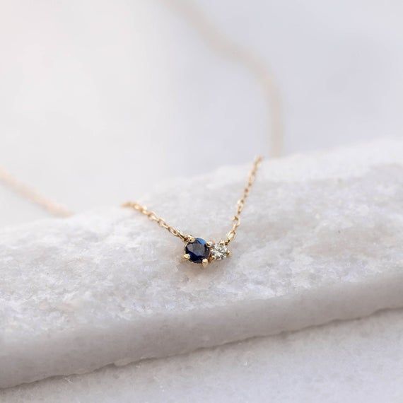 Blue Sapphire Diamond necklace in 14K solid yellow gold in cluster set. A minimal necklace for women with natural gemstones. A great gift for her. D E T A I L S● Metal: 14K solid gold, 14K white gold or 14K rose gold● Gemstones: Sapphire, round cut 3mm, Diamond, brilliant cut, 2mm● Gemstones Weight: Sapphire 0.10 ct, Diamond 0.03 ct● Length: 40 cm - 16 inchesH O W ∙ T O ∙ O R D E RChoose from the drop-down menu the available options (Metal) and leave us a note for any special requirements.G I F Elegant 14k Gold Birthstone Necklace For Birthday, Elegant Yellow Gold Birthstone Necklace For Birthday, Elegant Sapphire Jewelry For Birthday, Sapphire Necklace Simple, Danty Necklace, Natural Birthday, Dainty Gemstone Jewelry, Sapphire Diamond Necklace, Dainty Gemstone Necklace