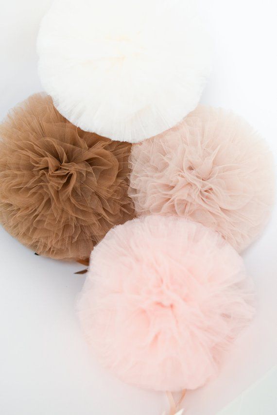 three pom poms are sitting on top of each other