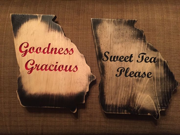 two pieces of wood sitting on top of a couch next to each other with the words goodness, sweet tea, please