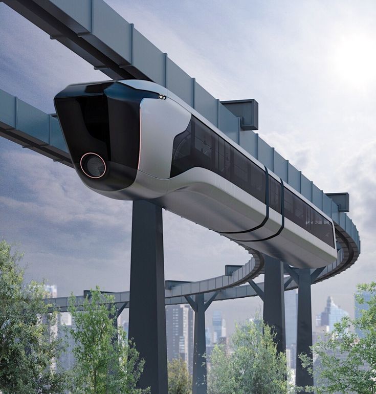 an image of a futuristic train going down the track in the city with trees and buildings