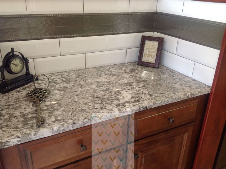 a clock sitting on top of a kitchen counter