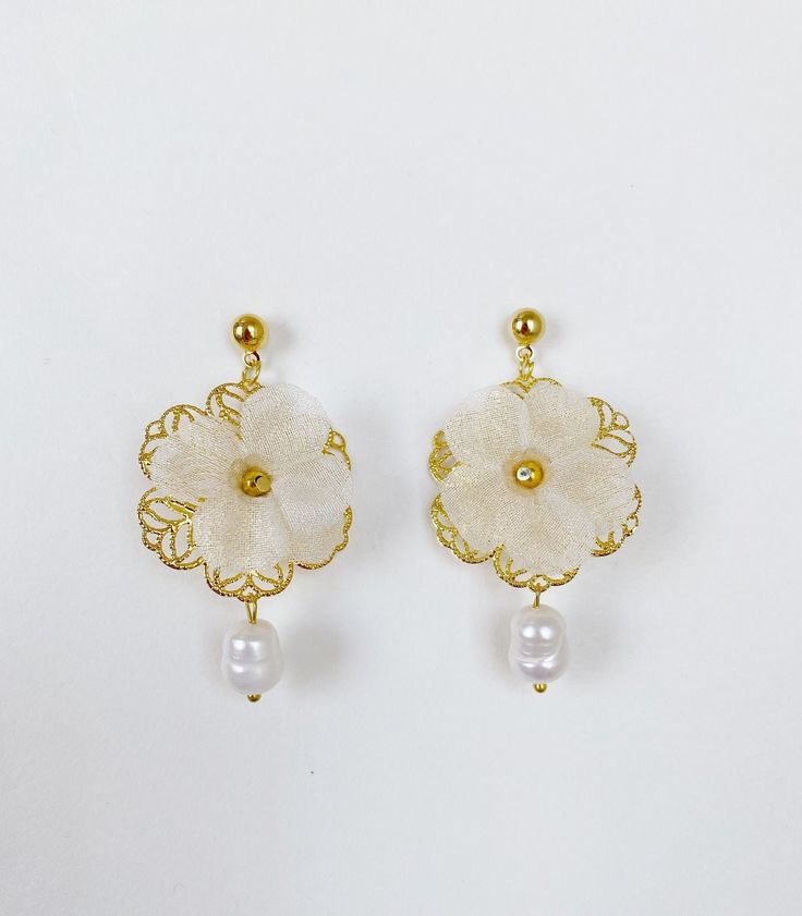 *Use discount FOURITEMS to get 10% off when you purchase 4 or more items (valid with jewelry, ceremony item, etc) * Designed and handcrafted in the Philippines by Filipino women artisans * Gold-plated brass studs with secure lock backs * Made of stainless steel gold plated hardware, handcrafted silk organza flowers characterized with sheerness that complements one's elegance, and baroque South Sea pearls, locally sourced from Cebu City in the Philippines to support traditional crafts * 2 inches in length, lightweight to wear all day * Each piece features 'intentional imperfections' - variations in exact size, cut, color, texture, and patterns. This adds to the individuality and unique story of each piece. Pearls are baroque and irregularly shaped, just as nature intended and may not exactl Filipino Pearl Jewelry, Traditional Filipino Jewelry, Filipino Earrings, Filipino Costume, Filipino Jewelry, Mama Jewelry, Ancient Fashion, Market Outfit, Philippine Islands