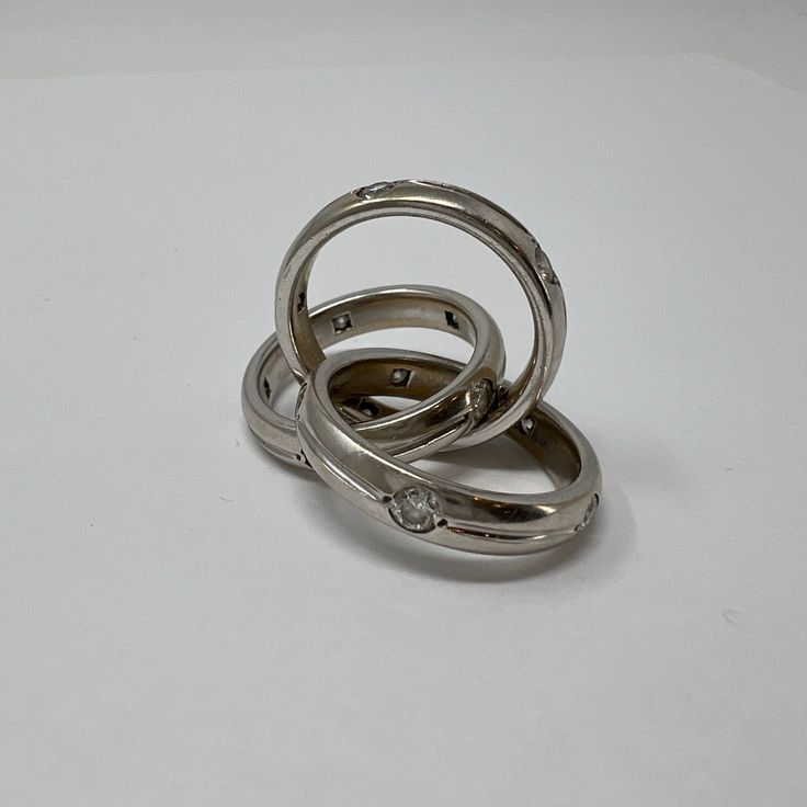 18K White Gold Rolling Rings with Diamonds (includes appraisal, Value:$13,000) Designer = Jewelry Size = 9 Material = 18K Gold Condition = Very Good Class = Premier Location: Glencoe Item Number: 12405-674 Item ID: 266939 Category: Ring Luxury Silver Diamond Ring Channel Set, Designer Rings With Polished Finish For Anniversary, Modern Hallmarked Stackable Rings For Formal Occasions, Modern Hallmarked Stackable Rings For Formal Events, Luxury Sterling Silver Diamond Ring Channel Set, Luxury Sterling Silver Channel Set Diamond Ring, Designer Hallmarked White Gold Rings, Luxury Diamond Rings With Polished Finish, Luxury Channel Set Diamond Ring In Sterling Silver