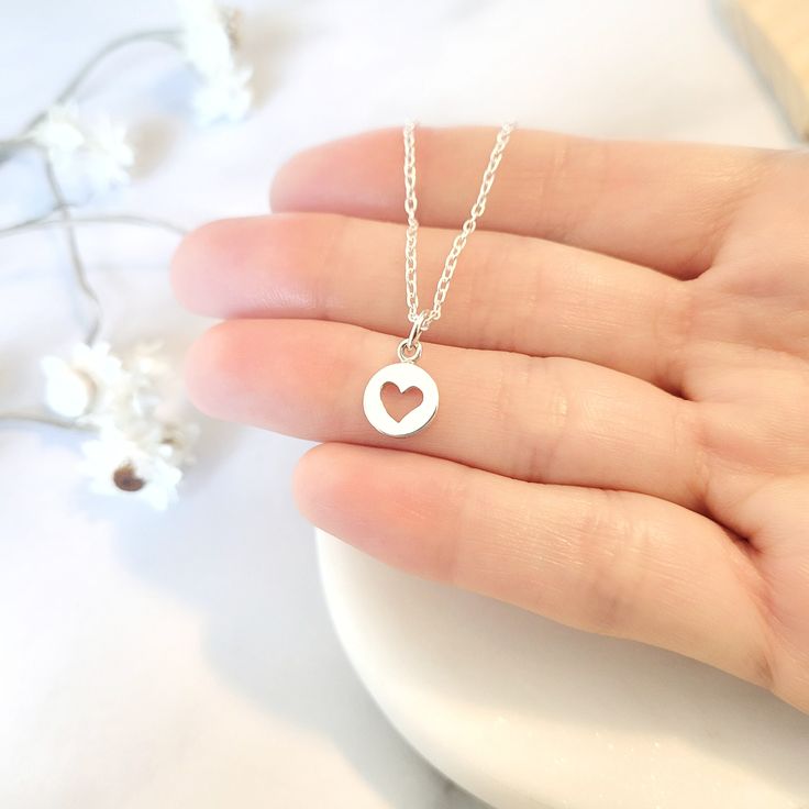 Beautiful handmade open heart pendant necklace in 925 sterling silver. Perfect to give to any woman or girl. It is a perfect gift for Valentine's Day, Birthday, Anniversary, Bridesmaid, Best Friends, Christmas, Mother's Day. Dress up your best outfit and wear this beautiful necklace. ♥Details: Metal type: Sterling silver Karat / purity: 925 Dimensions Charm: 14 x 8mm Dimensions Circle: 8mm x 8 mm ♥ Packaging: All jewels come in a beautiful package with a bow, ready to give away. Dimensions: 3.50 Minimalist Open Heart Sterling Silver Necklaces, Minimalist Round Charm Necklace For Valentine's Day, Dainty Hypoallergenic Necklace As A Gift, Dainty Hypoallergenic Necklaces For Gifts, Dainty Hypoallergenic Necklace For Gifts, Tiny Heart Cut Jewelry For Valentine's Day, Heart Charm Necklaces As A Gift For Her, Silver Minimalist Necklace For Valentine's Day, Minimalist Silver Necklace For Valentine's Day