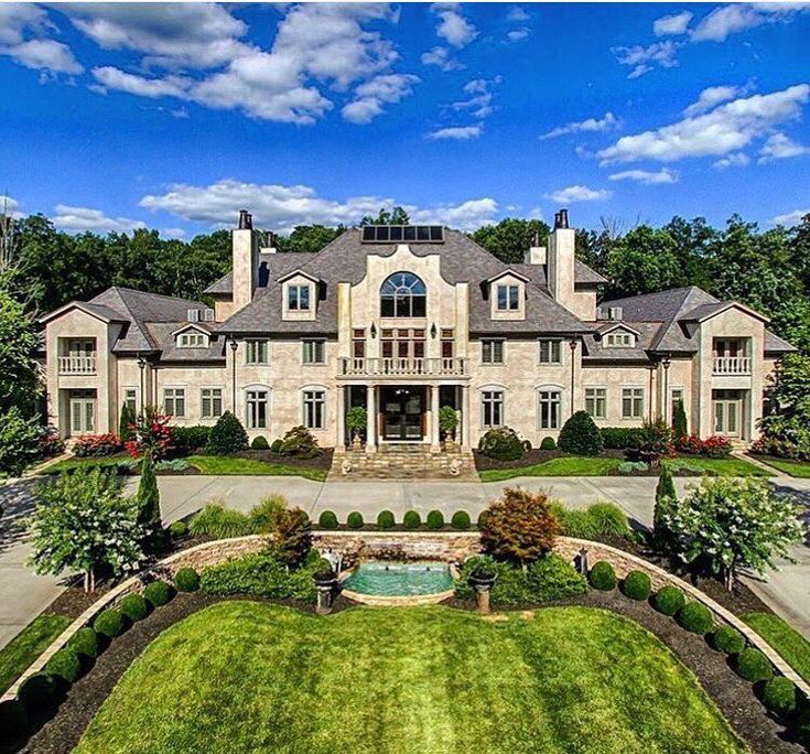 an aerial view of a large house with lots of windows