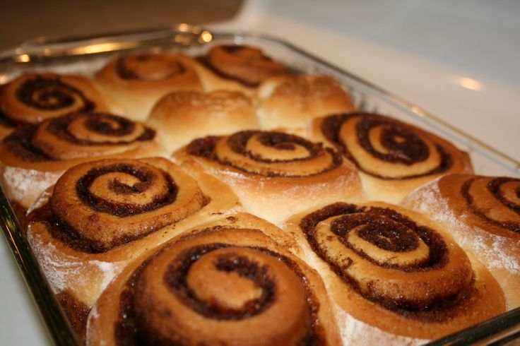 there are many cinnamon rolls in the pan