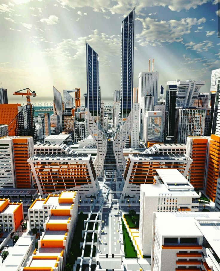 an aerial view of a city with skyscrapers and orange buildings in the foreground