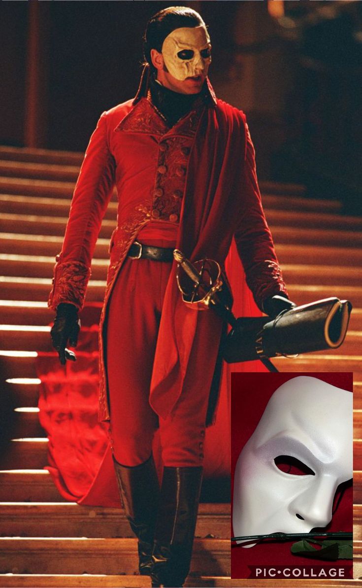 a man in a red outfit with a white mask