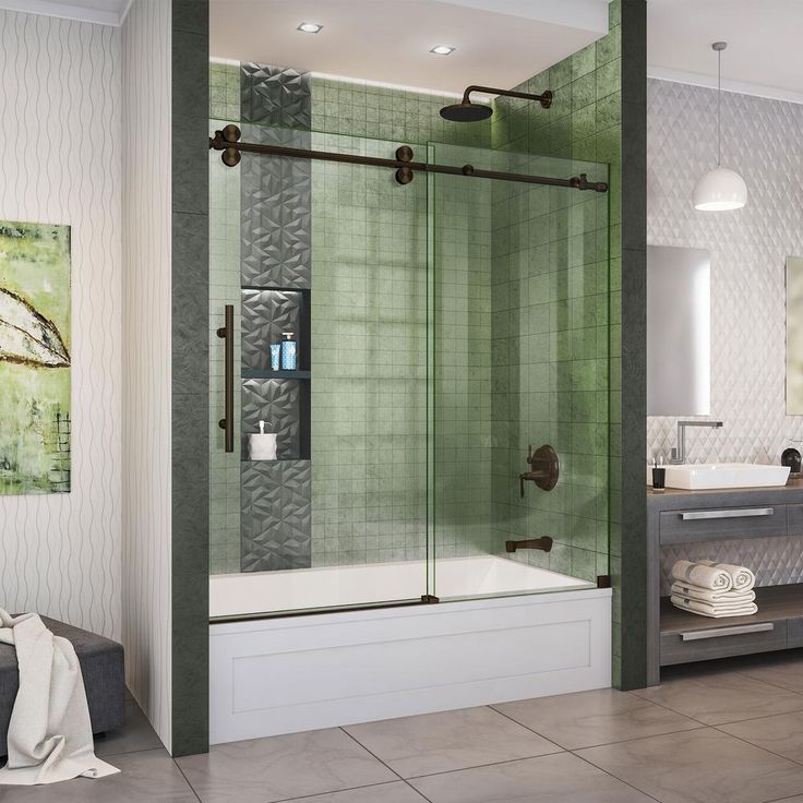 a bathroom with a walk in shower sitting next to a sink and a bathtub