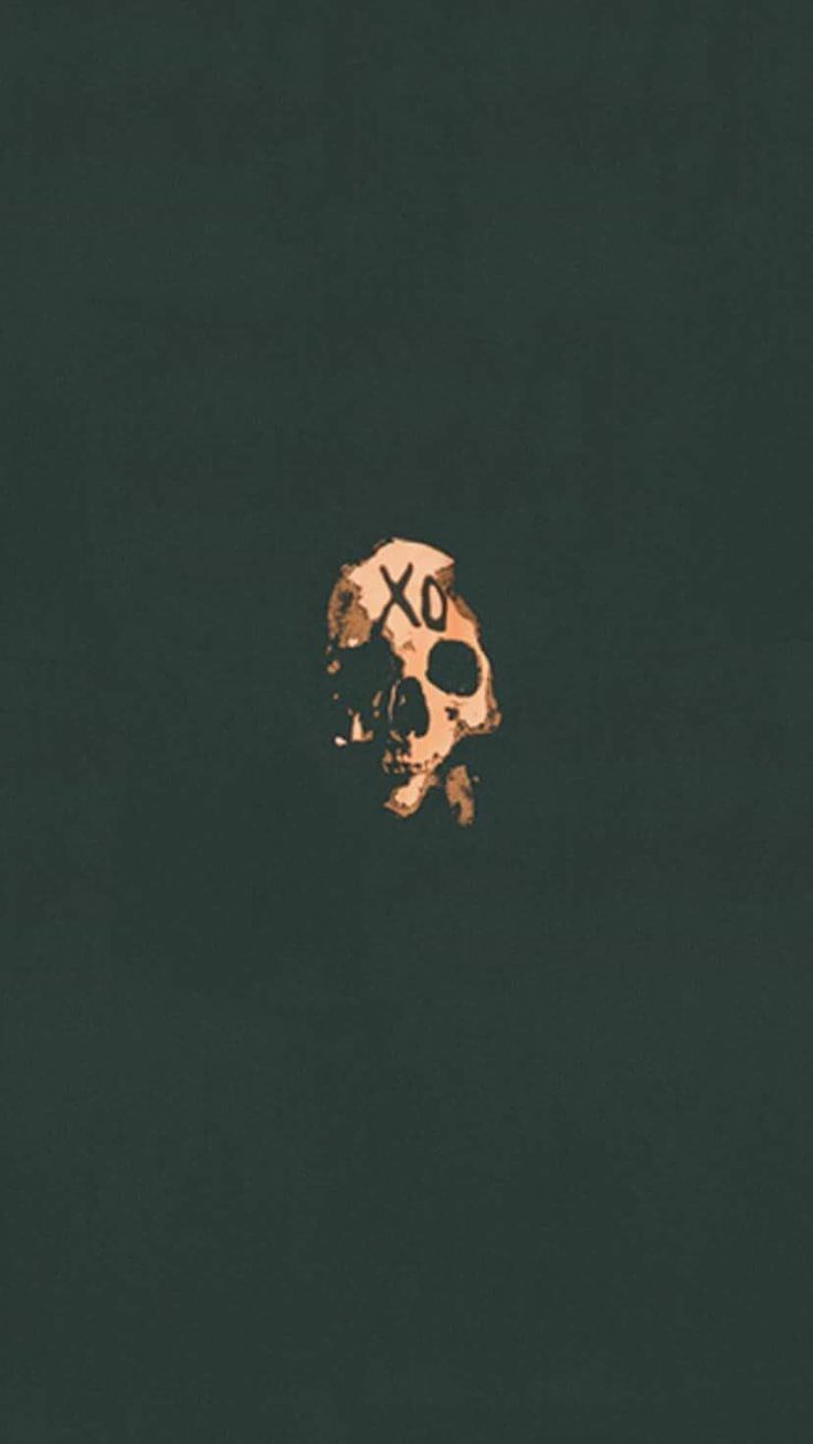 a skull and crossbone on a black background with the word xox written in gold