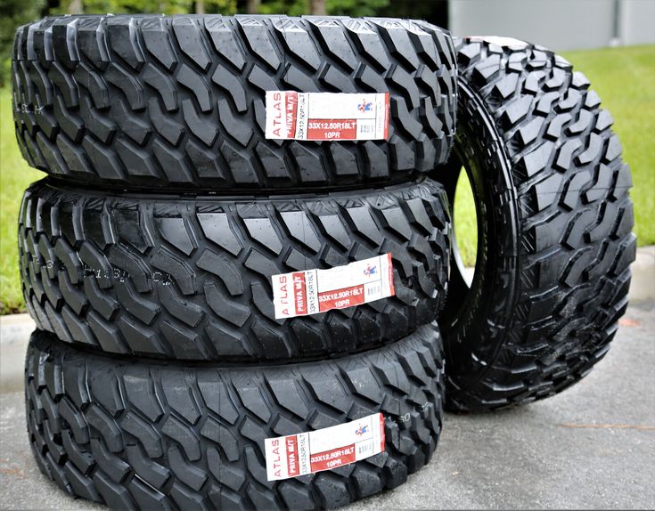 four tires are stacked on top of each other