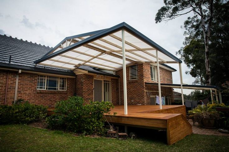 a house with a covered deck in front of it