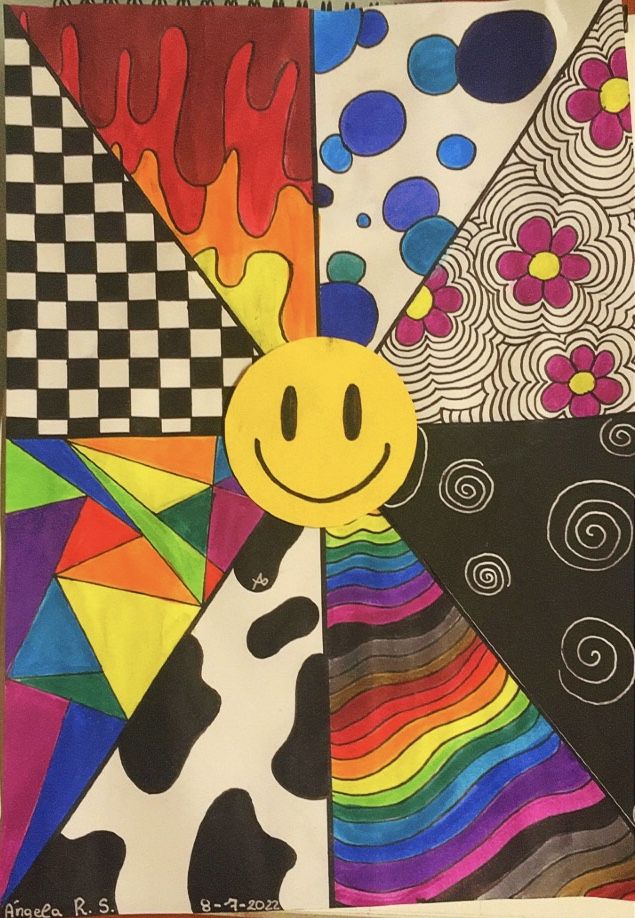 a drawing of a smiley face surrounded by colorful designs