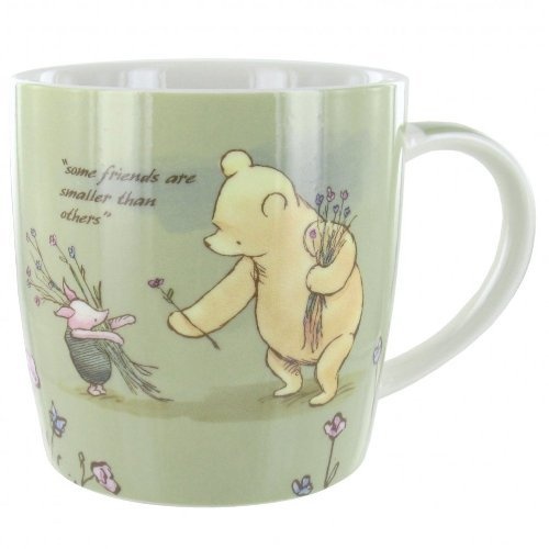 a coffee mug with a cartoon bear and mouse on the inside, saying some friends are smaller than others