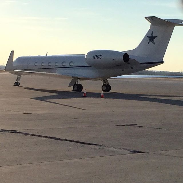 an airplane sitting on the tarmac at an airport