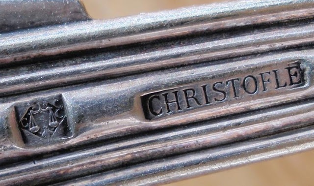 a close up of a metal object with the word christofle written on it