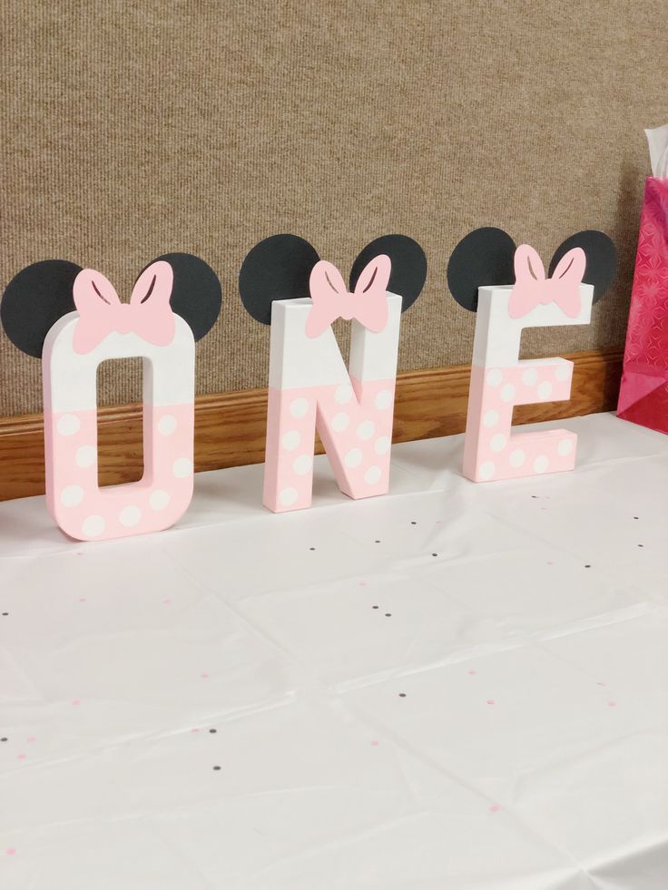 a minnie mouse sign sitting on top of a table