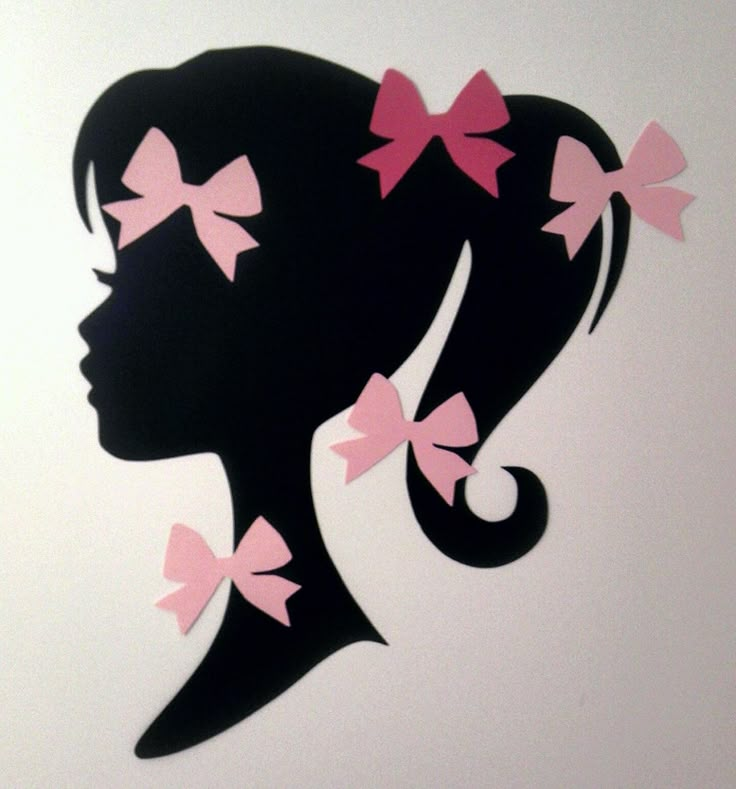 the silhouette of a woman with pink bows in her hair