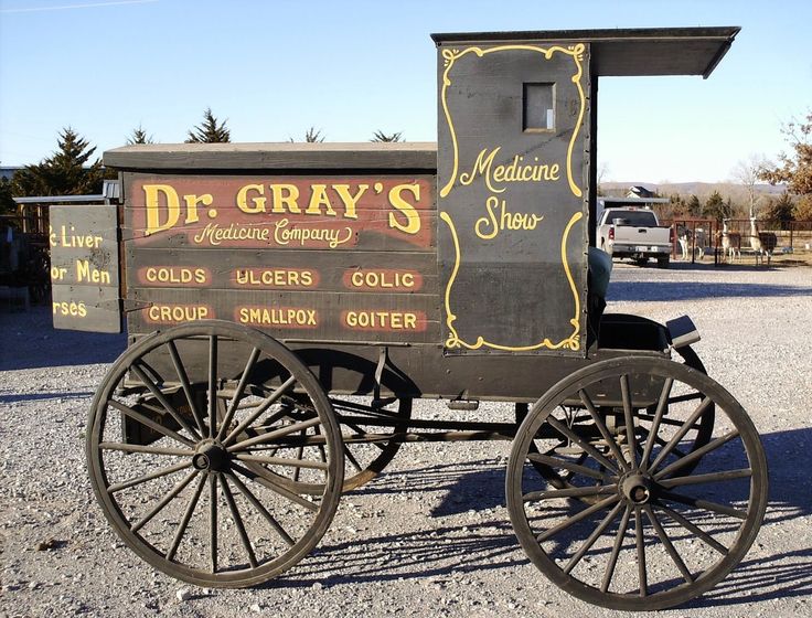 an old - fashioned dr gray's ice cream wagon is parked in the gravel